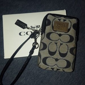 Black and silver coach wristlet w box never used